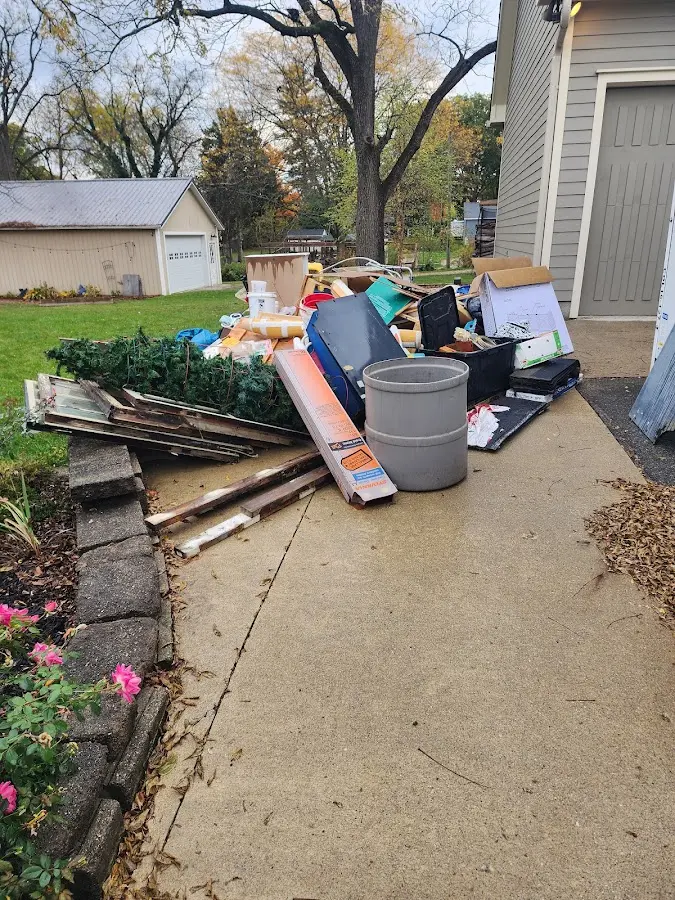Dumpster being loaded with debris for Estate Cleanout Dumpster Rental in South Gate Ridge